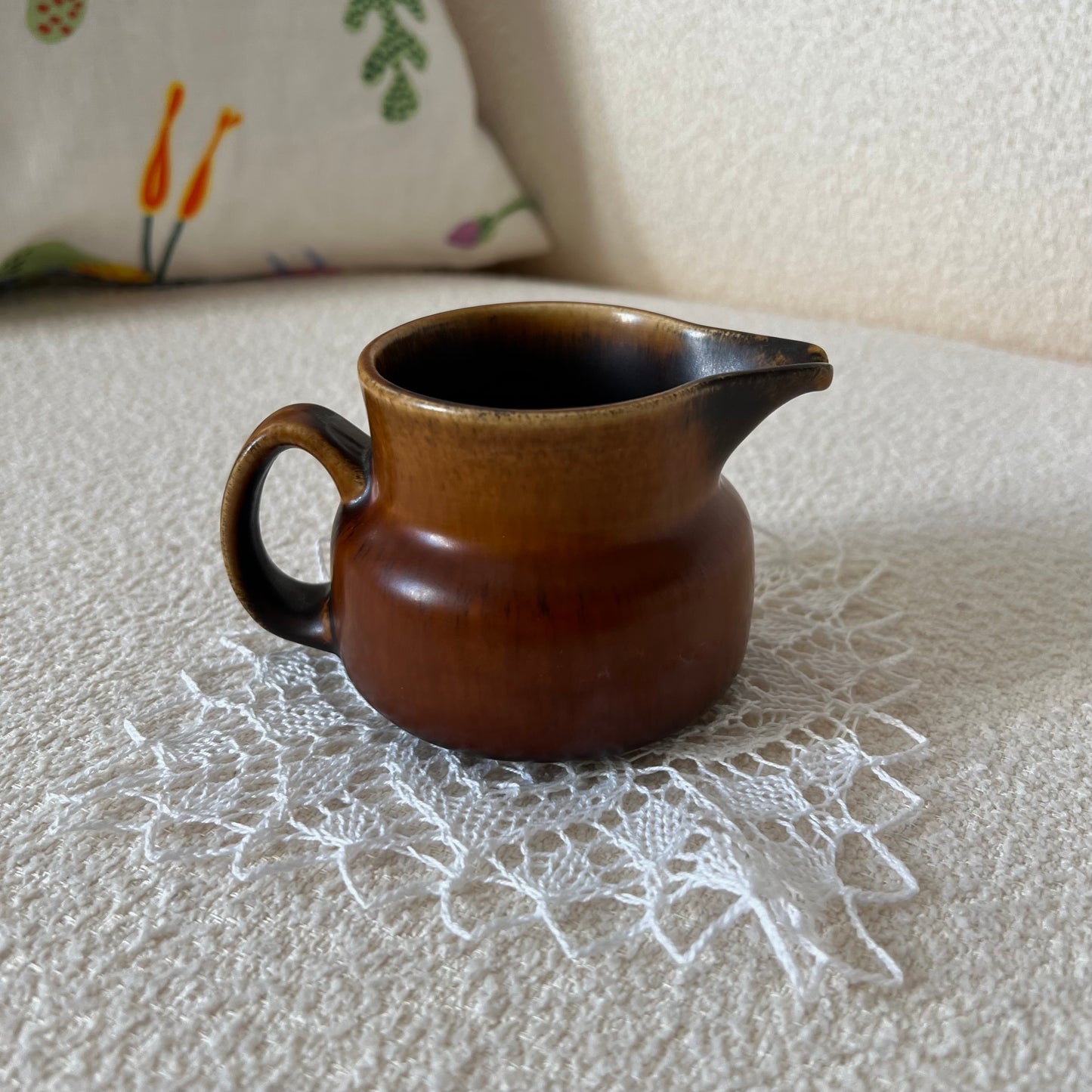 Brown ceramic milk jug